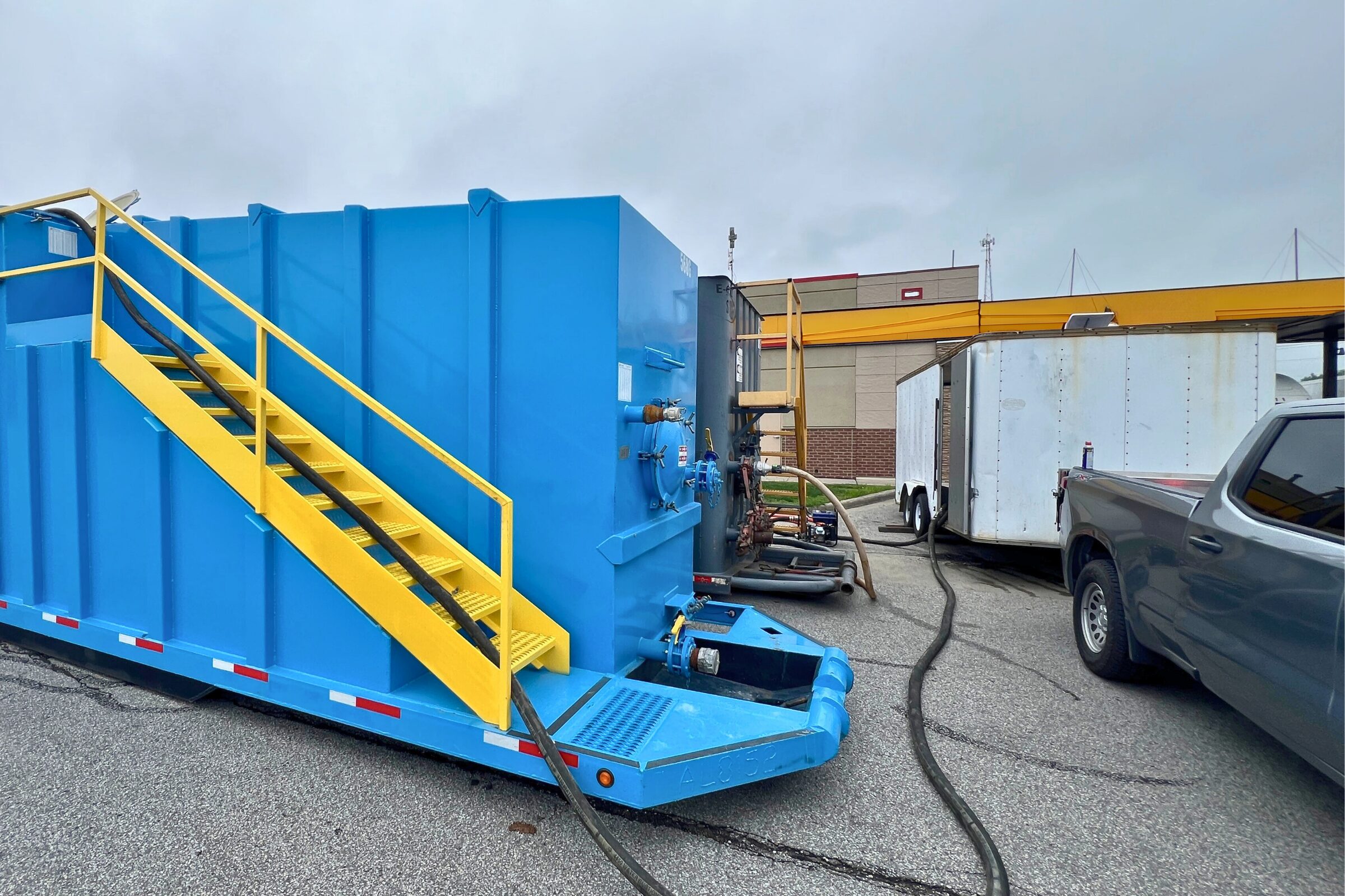 Temporary mobile water treatment system in operation at a truck stop, providing on-site wastewater management during infrastructure upgrades.